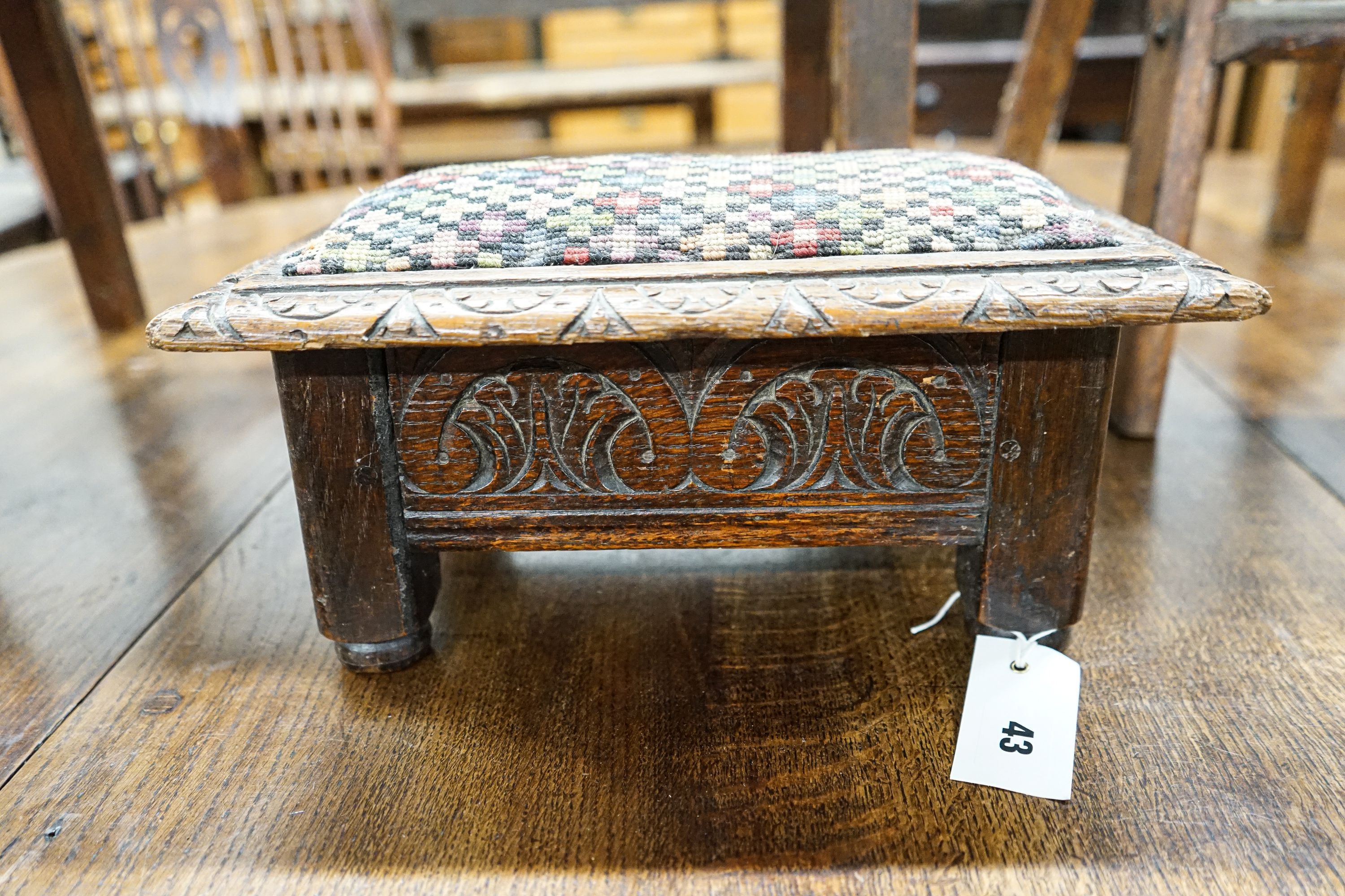 An 18th century oak low table, width 74cm, height 32cm, a carved oak foot stool and an Edwardian oak folding steps stool